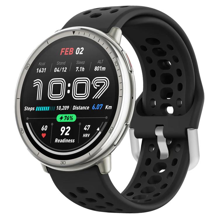 Black perforated silicone sport watch band fitted to a silver smartwatch
