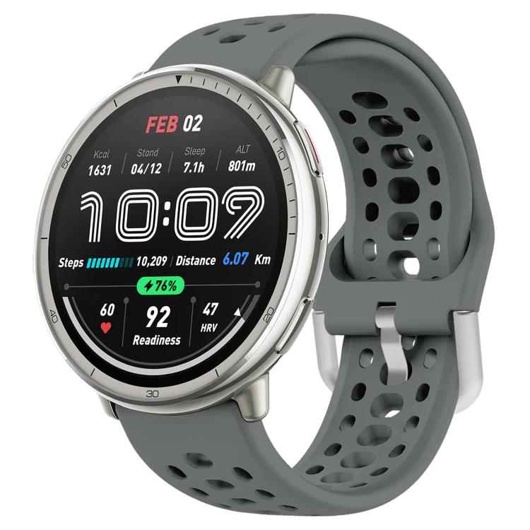 Gray perforated silicone sport watch band with silver buckle, fitted to a round watch