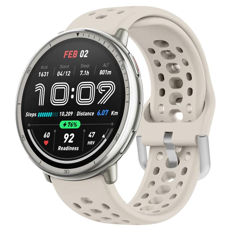Light beige perforated silicone sport watch band with silver buckle, fitted to a round watch