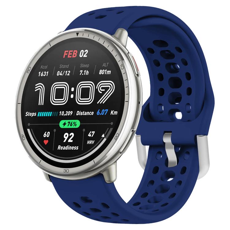 Navy blue perforated silicone sport watch band with silver buckle, fitted to a round watch