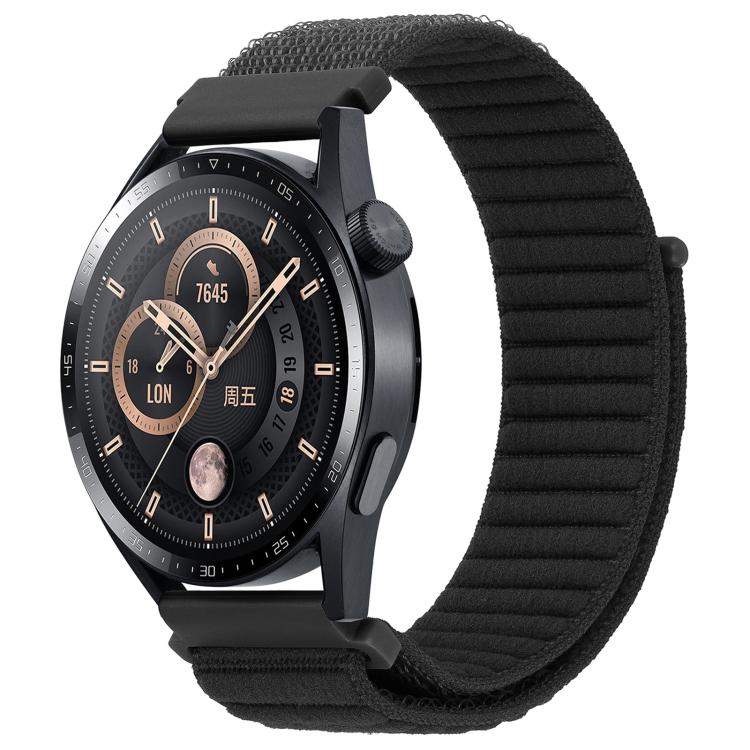 xDfind black ribbed nylon watch band with hook-and-loop closure on a black watch