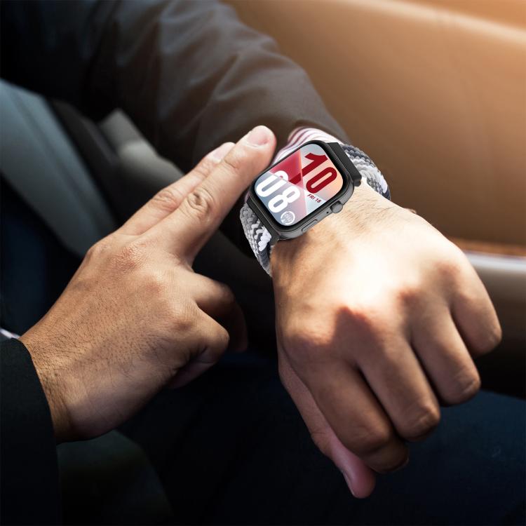 Gray, black, and white woven watch band worn on a wrist