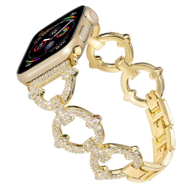 Gold Apple Watch band with crystal-studded O-shaped links and metal clasp