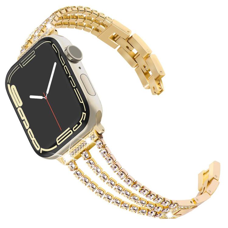 Gold three-row metal Apple Watch band with crystal accents and matching watch case.