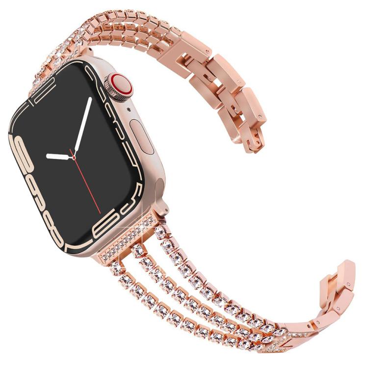 Rose gold three-row metal Apple Watch band with crystal accents.
