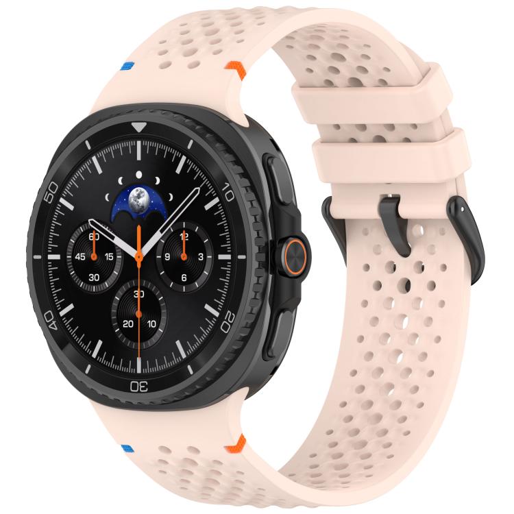 Pale pink perforated silicone watch band with black buckle on a smartwatch