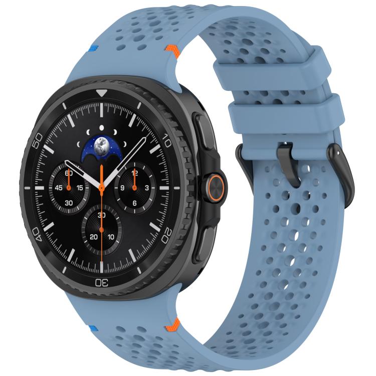 Blue perforated silicone watch band with black buckle on a smartwatch