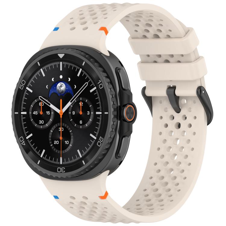 Cream perforated silicone watch band with black buckle, shown on a smartwatch.