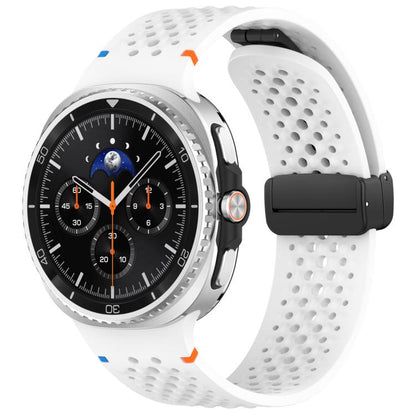 White perforated silicone watch band with black magnetic buckle, shown on a watch