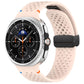 Pale pink perforated silicone watch band with black magnetic buckle, shown on a watch