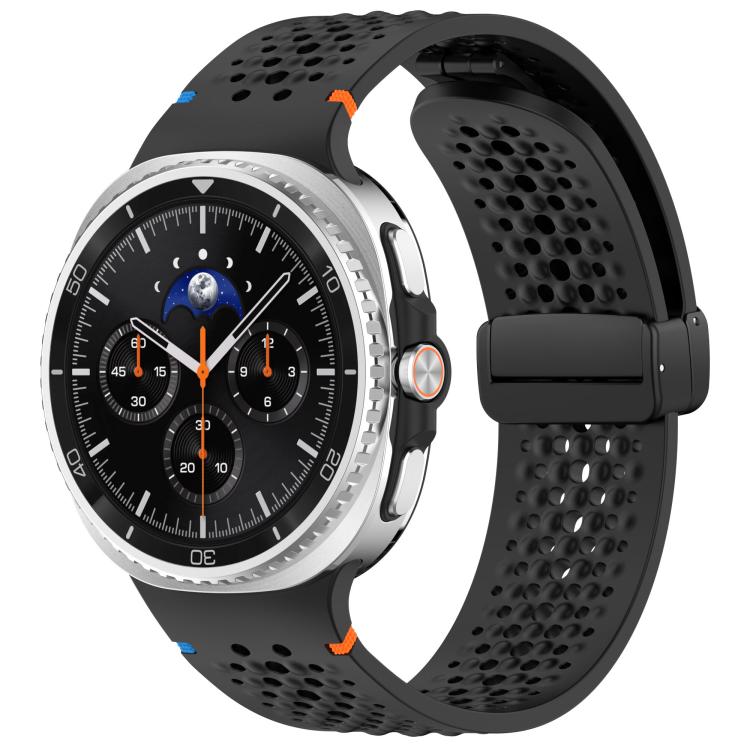 Black perforated silicone watch band with black magnetic buckle, shown on a watch