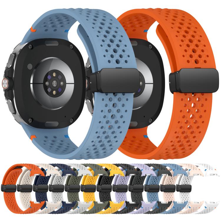 Perforated silicone watch bands in blue and orange, with black magnetic buckles.