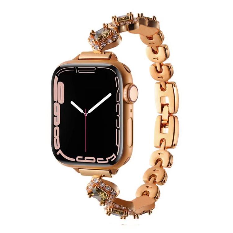 Rose gold metal Apple Watch band with crystal four-leaf clover links and watch