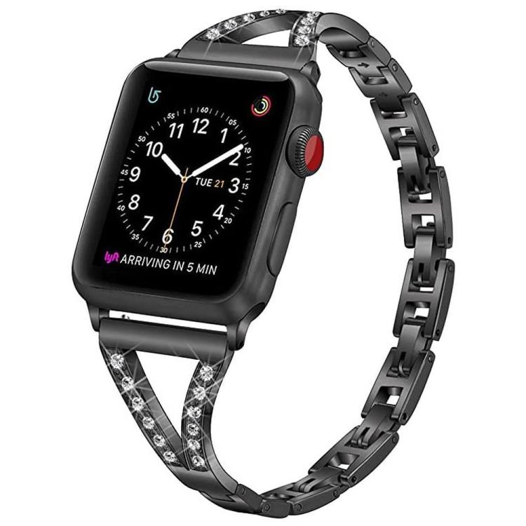 Black stainless steel watch band with crystal-set herringbone connectors, shown on a watch.