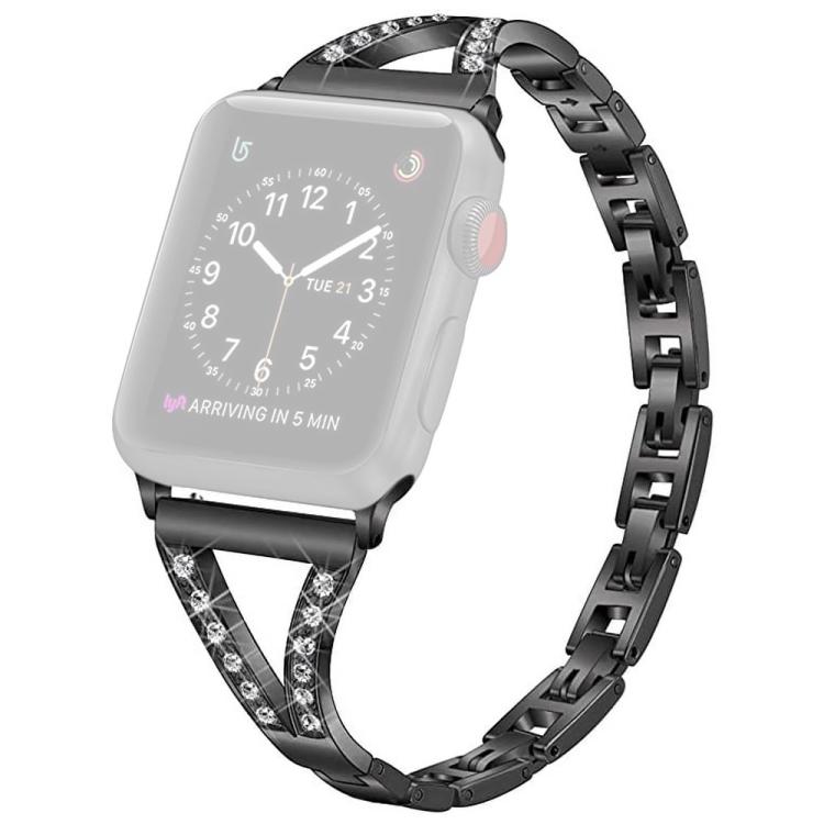 Black stainless steel watch band with crystal-set herringbone connectors, shown on a watch with a pale face.
