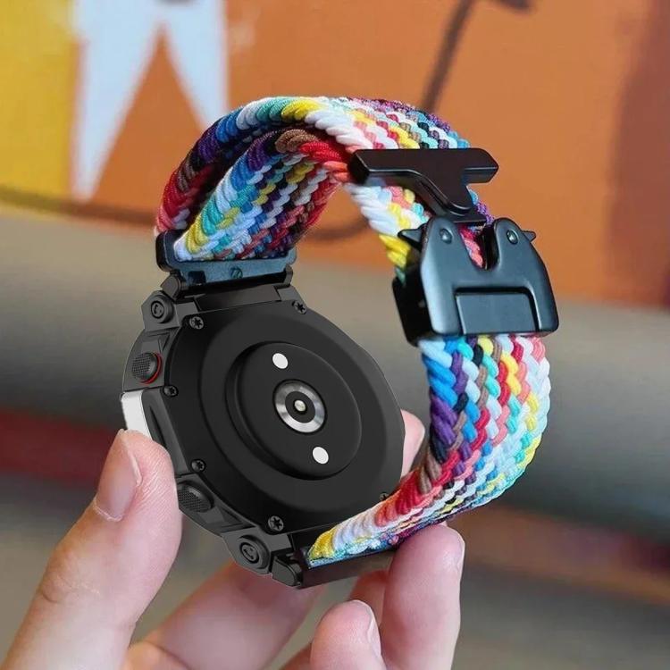 Multicolor braided watch band attached to a black smartwatch, showing the snap buckle
