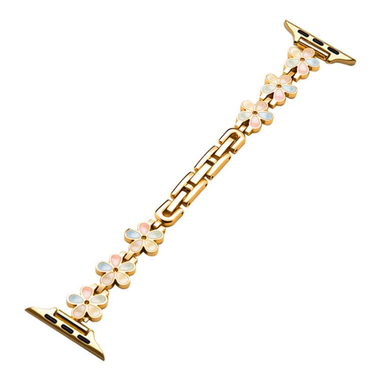 Gold metal Apple Watch band with linked flower-shaped enamel charms.