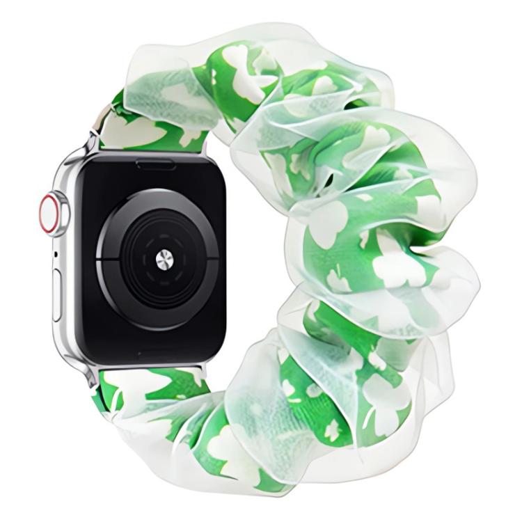 Ruffled organza Apple Watch band with a green and white four-leaf clover print