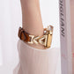 xDfind hybrid leather watch band worn on wrist, with brown strap and gold-tone V-shaped links