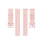 Light pink dot-textured silicone watch straps shown with buckles and hole rows