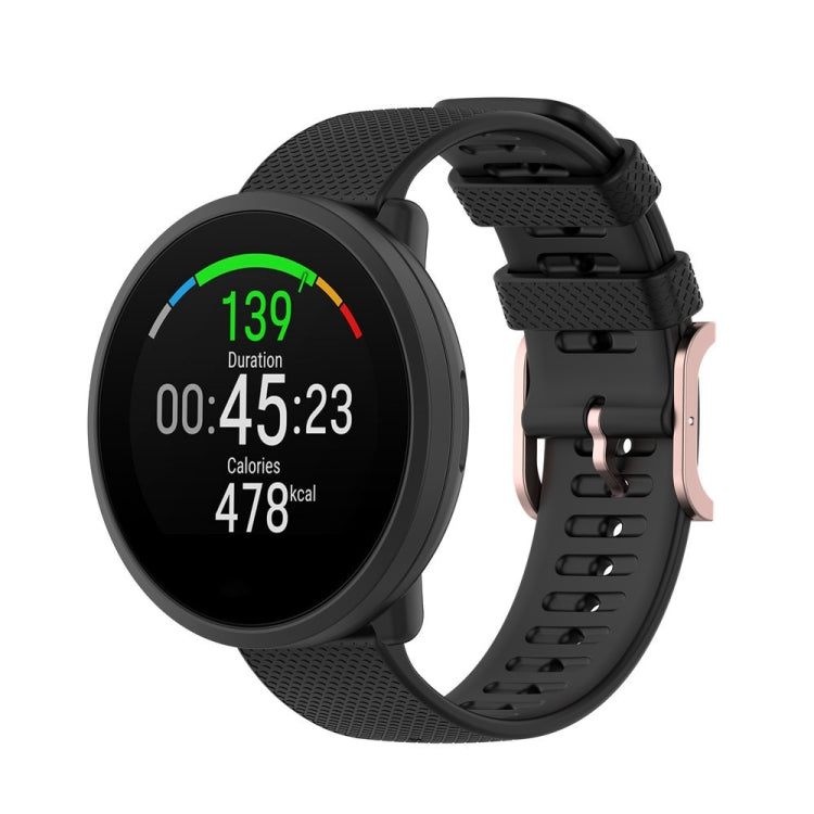 Dot-textured silicone watch strap in black, with adjustable buckle holes