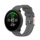 Dot-textured silicone watch strap in gray, with adjustable buckle holes
