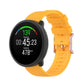 Dot-textured silicone watch strap in yellow, with adjustable buckle holes