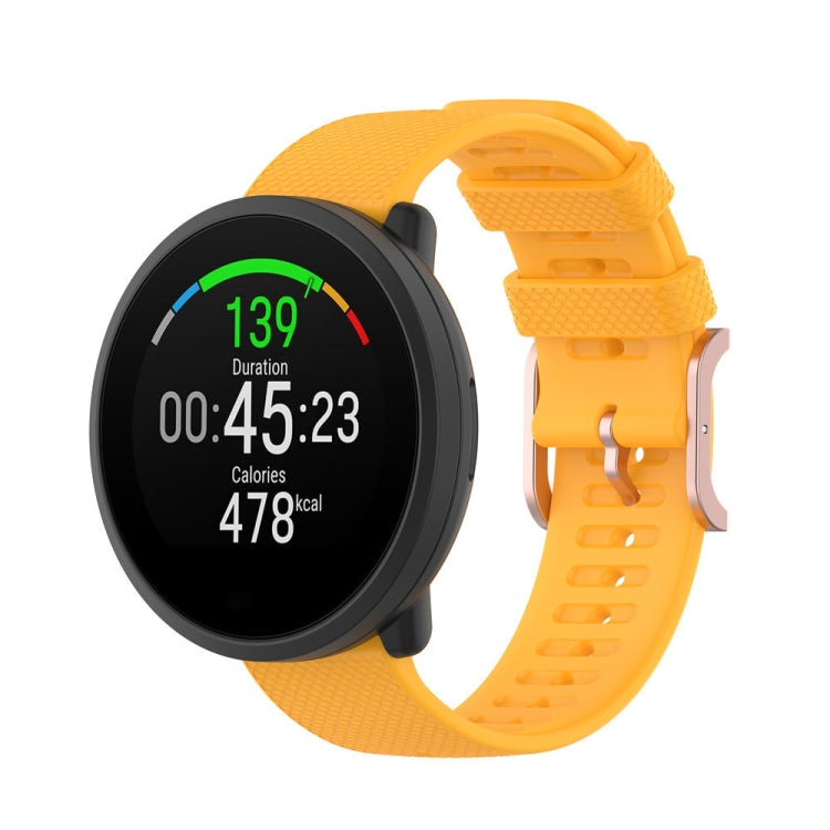 Dot-textured silicone watch strap in yellow, with adjustable buckle holes