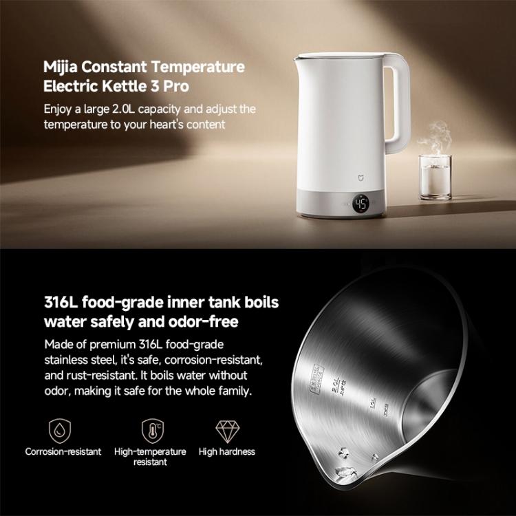 White electric kettle with spout and handle, shown with a glass of water