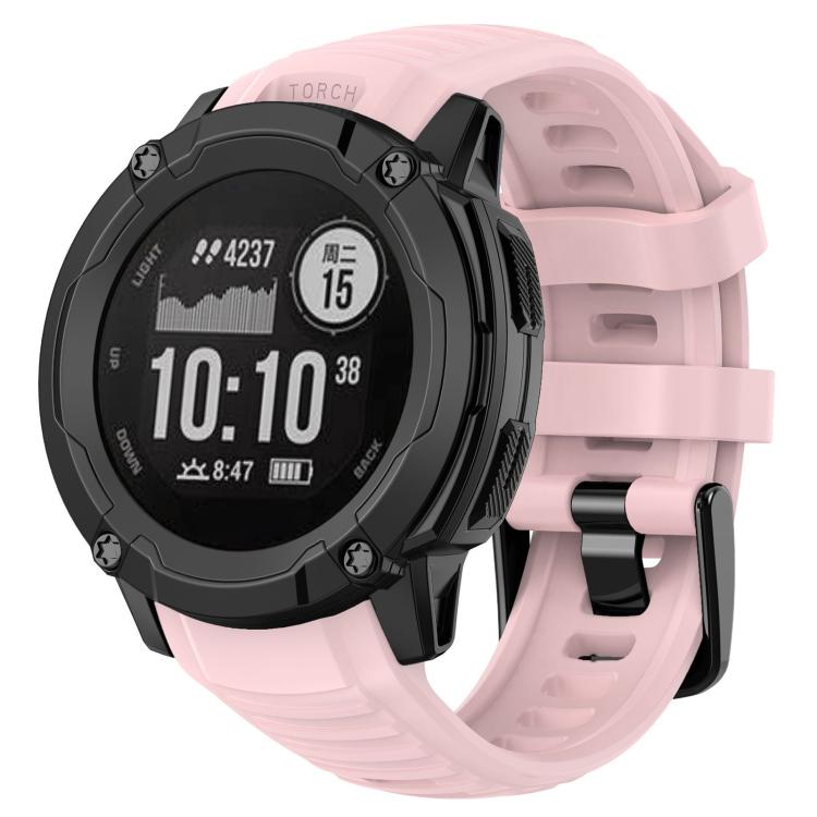 Pink silicone watch band fitted to a rugged round smartwatch
