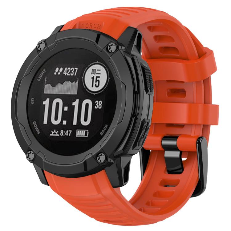 Bright red-orange silicone watch band fitted to a rugged round smartwatch