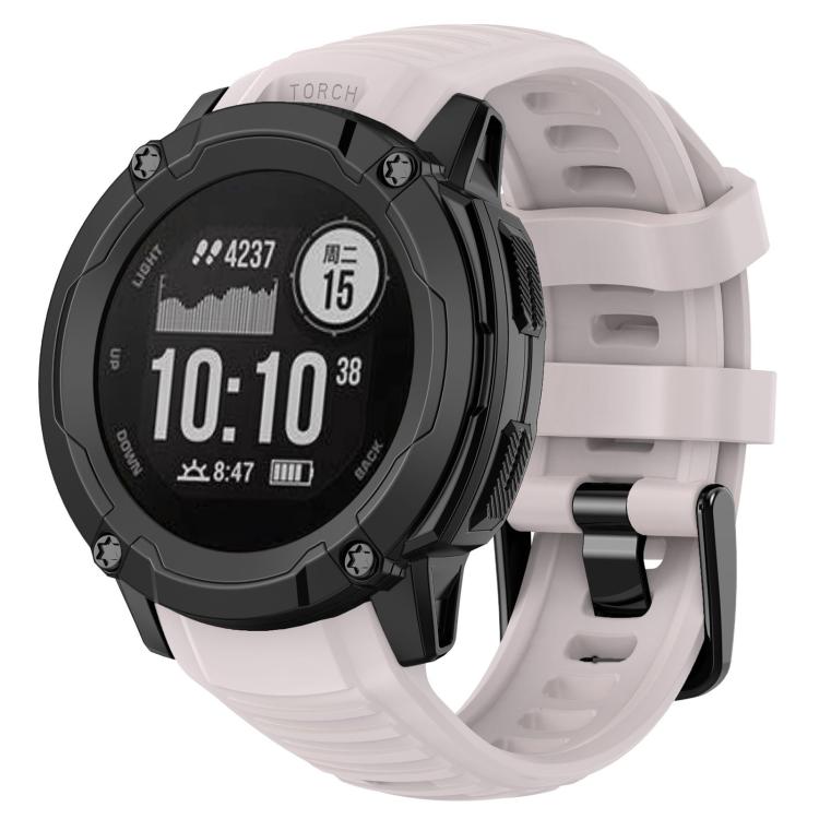 Silicone watch band in pale pink, fitted to a rugged round watch.