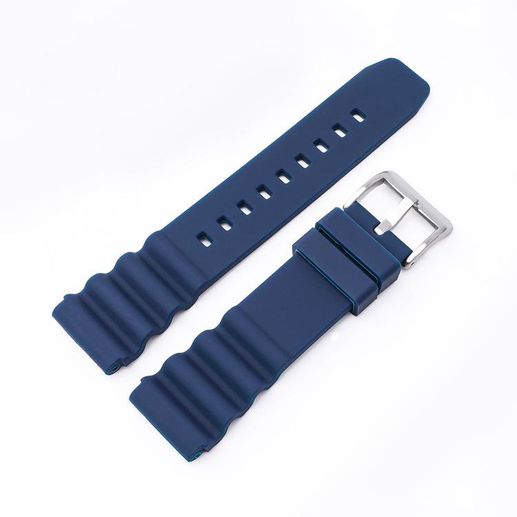 Navy blue silicone watch band with silver buckle and ridged ends