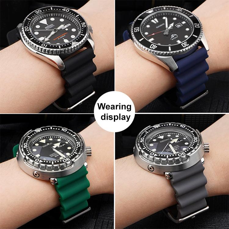 Silicone watch bands worn on watches in black, navy, green, and gray