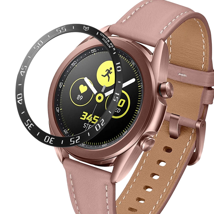 Smartwatch bezel ring with rose-brown leather strap, rose-gold case, black ring with white letters