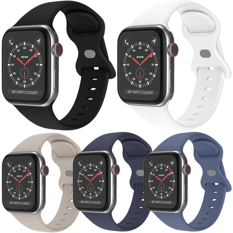 Five silicone Apple Watch bands in black, white, beige, navy, and blue with butterfly buckles.