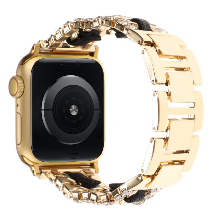 Gold metal Apple Watch band with black inserts and crystal-like edge details