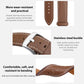 Brown vegan leather watch band with white stitching, adjustment holes, and stainless steel buckle.