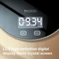 Close-up of black scale with digital LCD display showing weight and two control buttons
