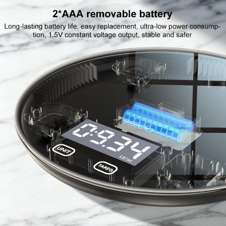 Bottom view of black electronic kitchen scale with battery compartment and circuit detail