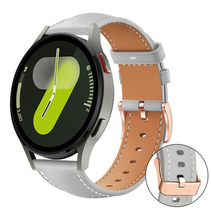 Watch band with light gray outer strap, tan lining, and rose gold buckle