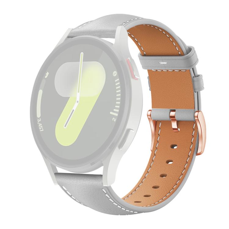 Light gray watch band with tan lining, white stitching, and rose gold buckle