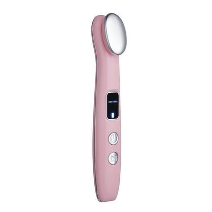 Pink hot compress eye massager with oval heating head and control buttons.