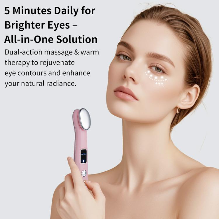 Pink hot compress eye massager held near the cheek with oval heating head.