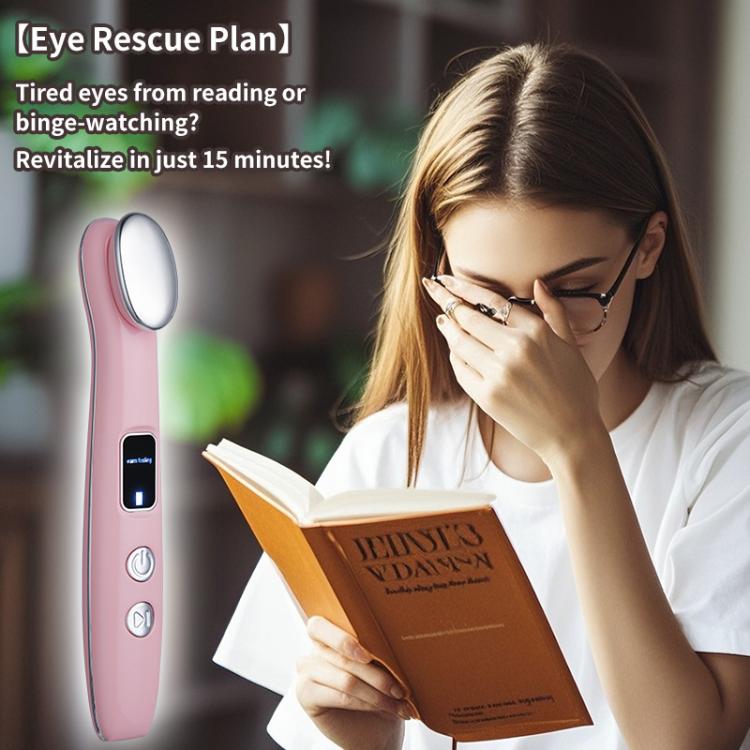 Pink hot compress eye massager held by a person near the eye area.
