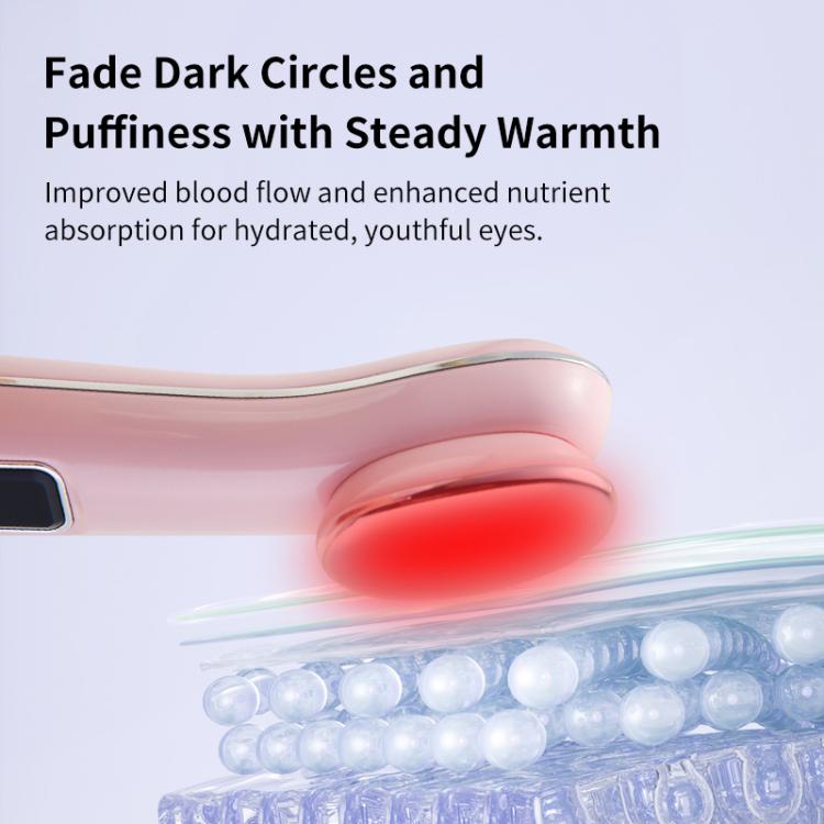 Close-up of pink hot compress eye massager head with glowing warmth ring.