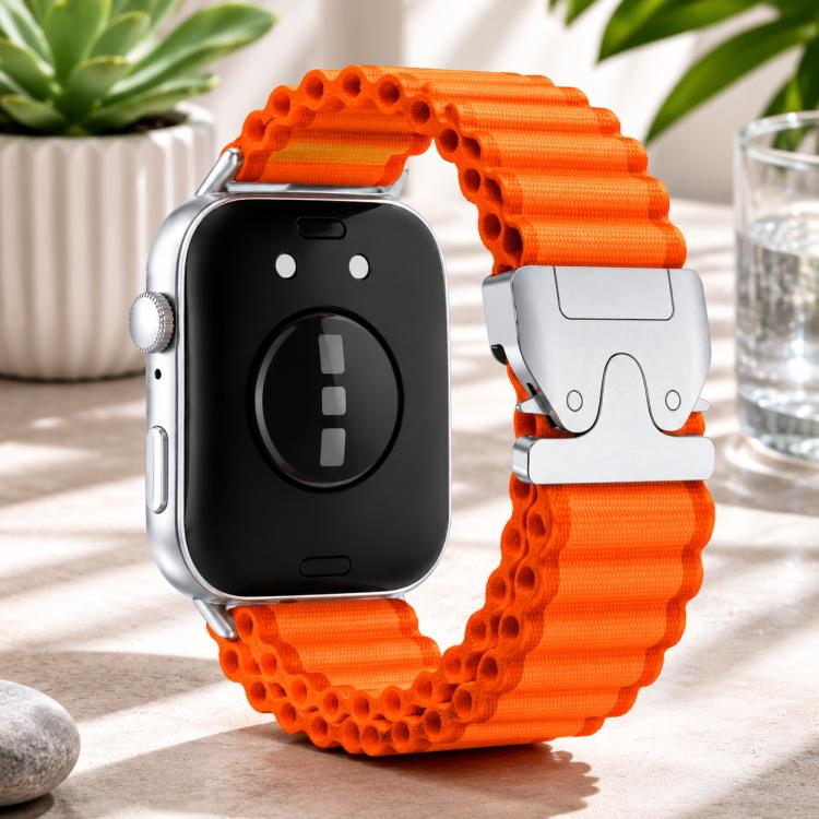 Orange nylon watch band with silver parachute buckle, shown fitted to a smartwatch