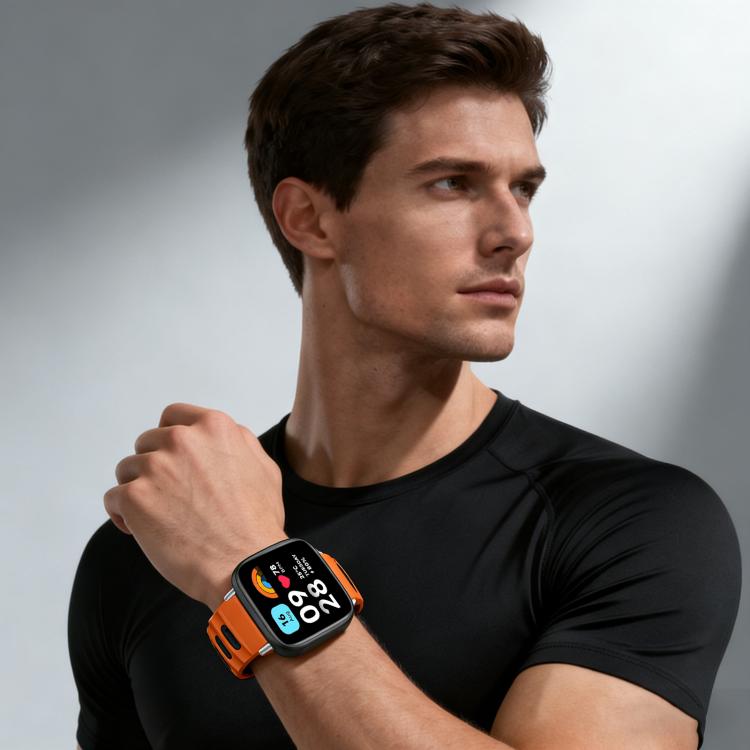 Smartwatch with an orange and black silicone band worn on a wrist