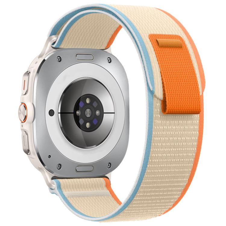 Beige nylon watch band with blue edging and an orange closure tab