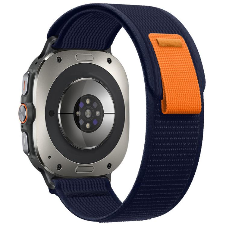 Navy nylon watch band with orange pull tab, shown attached to a watch